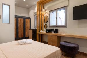 Posteľ alebo postele v izbe v ubytovaní Zoe Suites