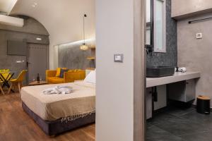 Posteľ alebo postele v izbe v ubytovaní Zoe Suites + 9 fotografií