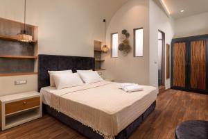a bedroom with a large bed in a room at Zoe Suites in Rhodes Town