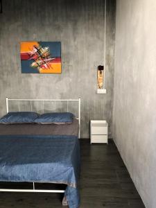 Postel nebo postele na pokoji v ubytování Rembulan Langkawi Guesthouse