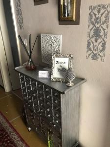 a black dresser with a box on top of it at Casa Perla in Lavagna