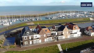 an aerial view of a house in front of a marina at Appartement Residence Oude Haven Colijnsplaat in Colijnsplaat