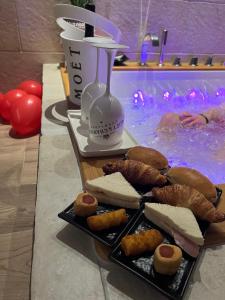 a plate of food next to a swimming pool at Eden Room&Spa in Torre Maggiore
