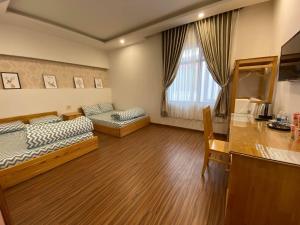 Kuchyň nebo kuchyňský kout v ubytování Tuan Long Da Lat Hostel