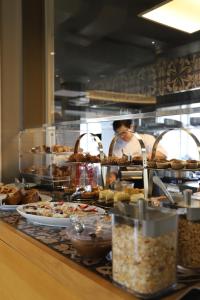 a buffet line with many different types of food at Hotel Villa Pascucci in Durrës