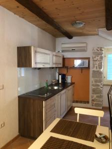 a kitchen with a sink and a counter top at Romantic studio old town in Vrsar