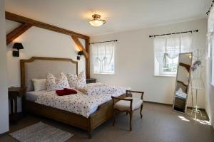 Postel nebo postele na pokoji v ubytování Familien- und Apartmenthotel Lerchenberghof