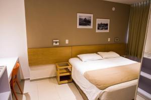 Кровать или кровати в номере Atlantis Copacabana Hotel