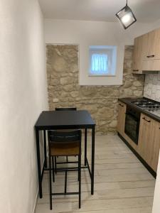 Kuchyň nebo kuchyňský kout v ubytování LA CASA DI PIETRA