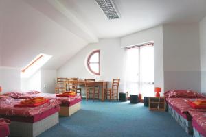 Posteľ alebo postele v izbe v ubytovaní LEO - PENZION