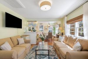 a living room with a couch and a table at 817 E Ashely Ave Pleasant Breeze in Folly Beach