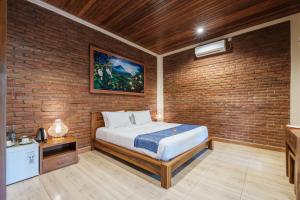 Säng eller sängar i ett rum på Dhiari Guest House