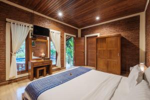 En eller flere senge i et værelse på Dhiari Guest House