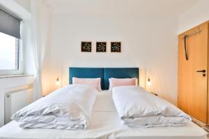 Ein Bett oder Betten in einem Zimmer der Unterkunft Hotel JUMAs