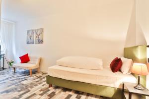 Ein Bett oder Betten in einem Zimmer der Unterkunft Hotel JUMAs