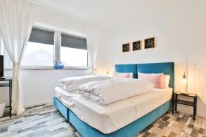 Ein Bett oder Betten in einem Zimmer der Unterkunft Hotel JUMAs