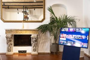 A television and/or entertainment centre at Pantheon by Agrippa Suite