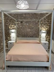Postel nebo postele na pokoji v ubytování LA CASA DI PIETRA