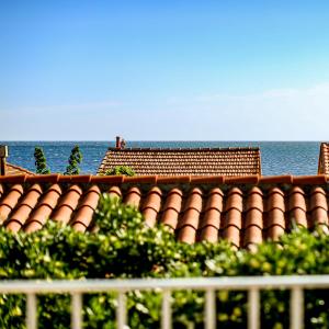 a roof of a building with the ocean in the background at Le Fanal in Argelès-sur-Mer