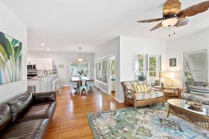 a living room with a couch and a table at 307 W Indian - The Prickly Pear in Folly Beach