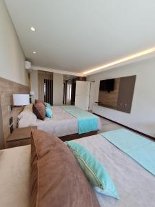 Cama ou camas em um quarto em Hotel Estilo MB - Merlo