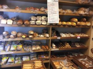 a bakery filled with lots of different types of bread at László Nyaralóház in Balatonfenyves