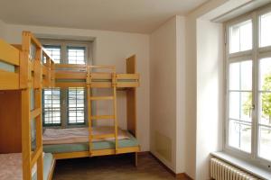 Postel nebo postele na pokoji v ubytování Richterswil Youth Hostel