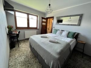Postel nebo postele na pokoji v ubytování Sierockie Szczyty