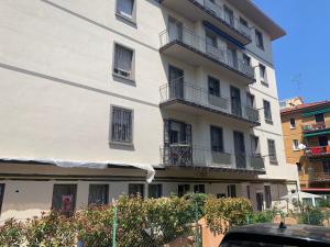 a large white building with balconies on it at Bologna Facile in Bologna