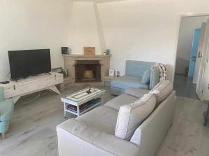 Posezení v ubytování Vila com piscina e jardim privado