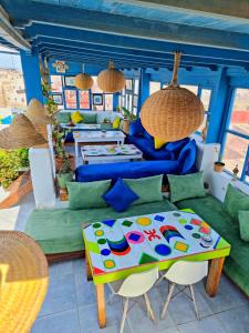 a living room with a couch and a table at Atlantic Hostel in Essaouira