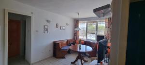 a living room with a couch and a table at CENTRAL APARTAMENT La malul marii 3 camere & Living in Mangalia