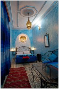 Tempat tidur dalam kamar di Riad El Blida