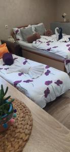 A bed or beds in a room at Velvita Sliven