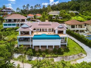 an aerial view of a house with a swimming pool at Villa E in Taling Ngam Beach