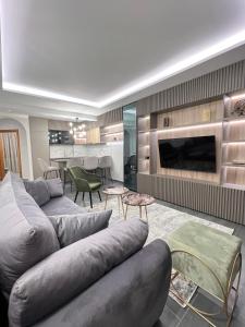 a living room with a couch and a fireplace at Varja 3 Apartment in Pržno