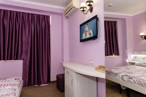 Postel nebo postele na pokoji v ubytování Kirios Hotel