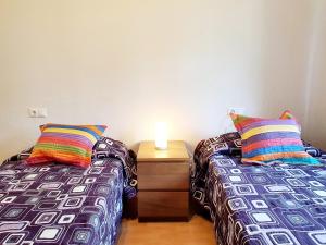 A bed or beds in a room at CASA DE LA PLAYA: La Cala de Mijas