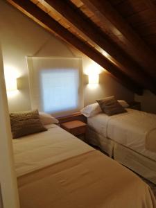 Кровать или кровати в номере Villa Marilú