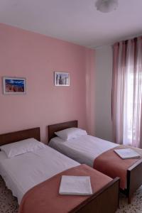 Un ou plusieurs lits dans un hébergement de l'établissement Hotel kozani