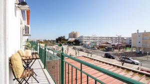 a balcony with a view of a city street at Altura Vacations T2, Algarve in Altura