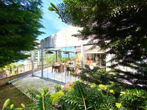 a glass house with a table and chairs on a patio at Caykent Suites Deluxe Hotel in Trabzon