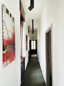 a hallway of a house with white walls and a hallway at South Garda Suites in Desenzano del Garda