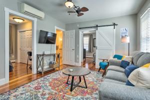 a living room with a couch and a table at Mystic Refuge with Patio Less Than 1 Mi to Downtown! in Mystic
