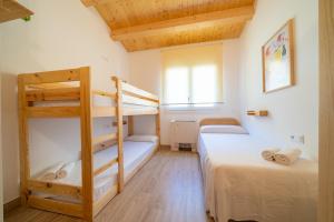 Posteľ alebo postele v izbe v ubytovaní HomeHolidaysRentals Benoit - Costa Barcelona + 37 fotografií
