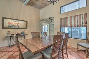 a dining room with a wooden table and chairs at Community Pool Pueblo Home Near Downtown Mesa in Mesa