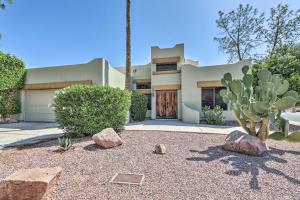 a house with a cactus and rocks in front of it at Community Pool Pueblo Home Near Downtown Mesa in Mesa