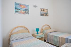 Postel nebo postele na pokoji v ubytování Villa Sunset