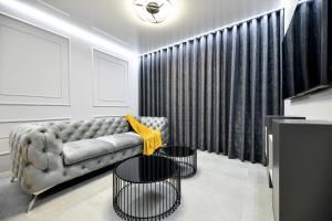 Televízia a/alebo spoločenská miestnosť v ubytovaní Sigma Exclusive Apartment