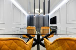 Televízia a/alebo spoločenská miestnosť v ubytovaní Sigma Exclusive Apartment